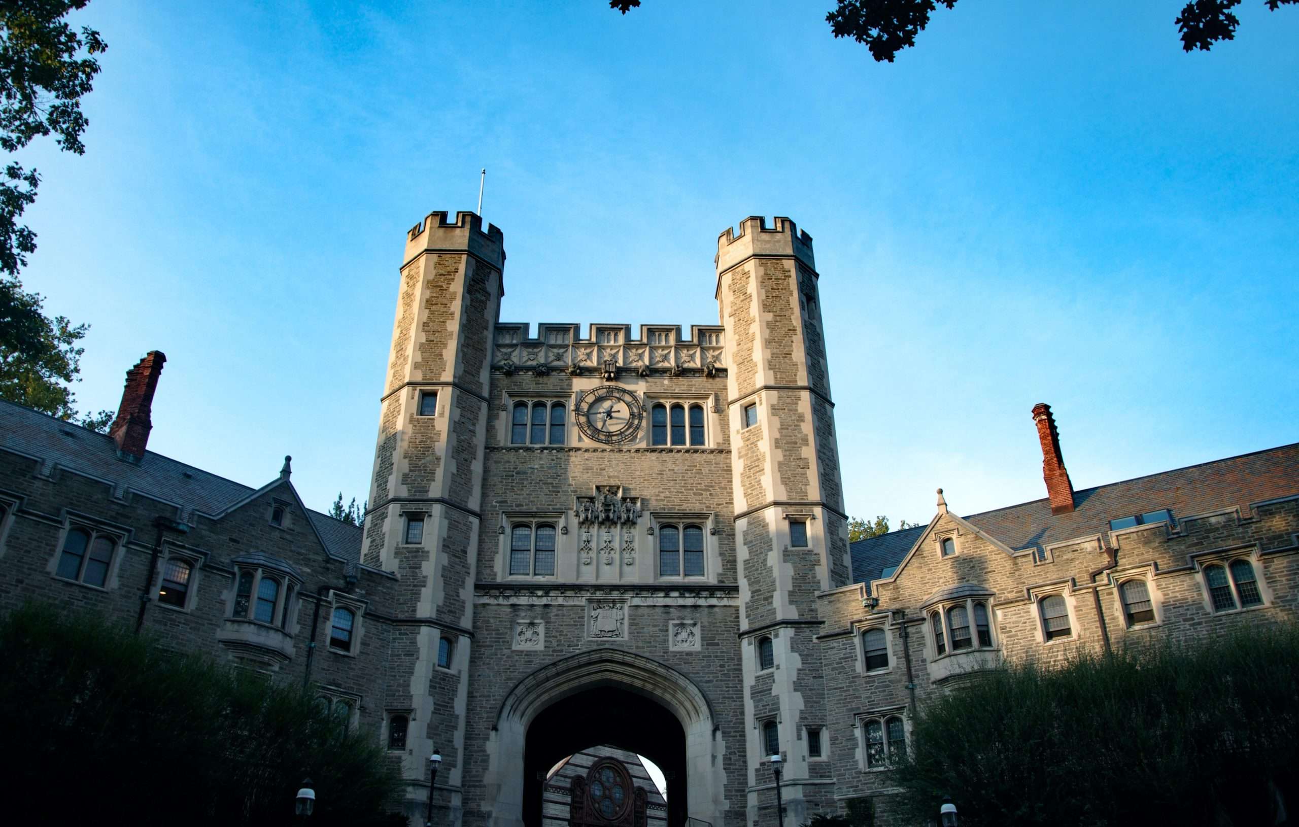 A Gothic college dorm is featured at sunset.