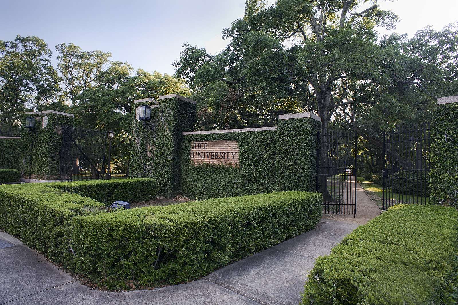 The ivy-covered entrance to Rice University is featured.