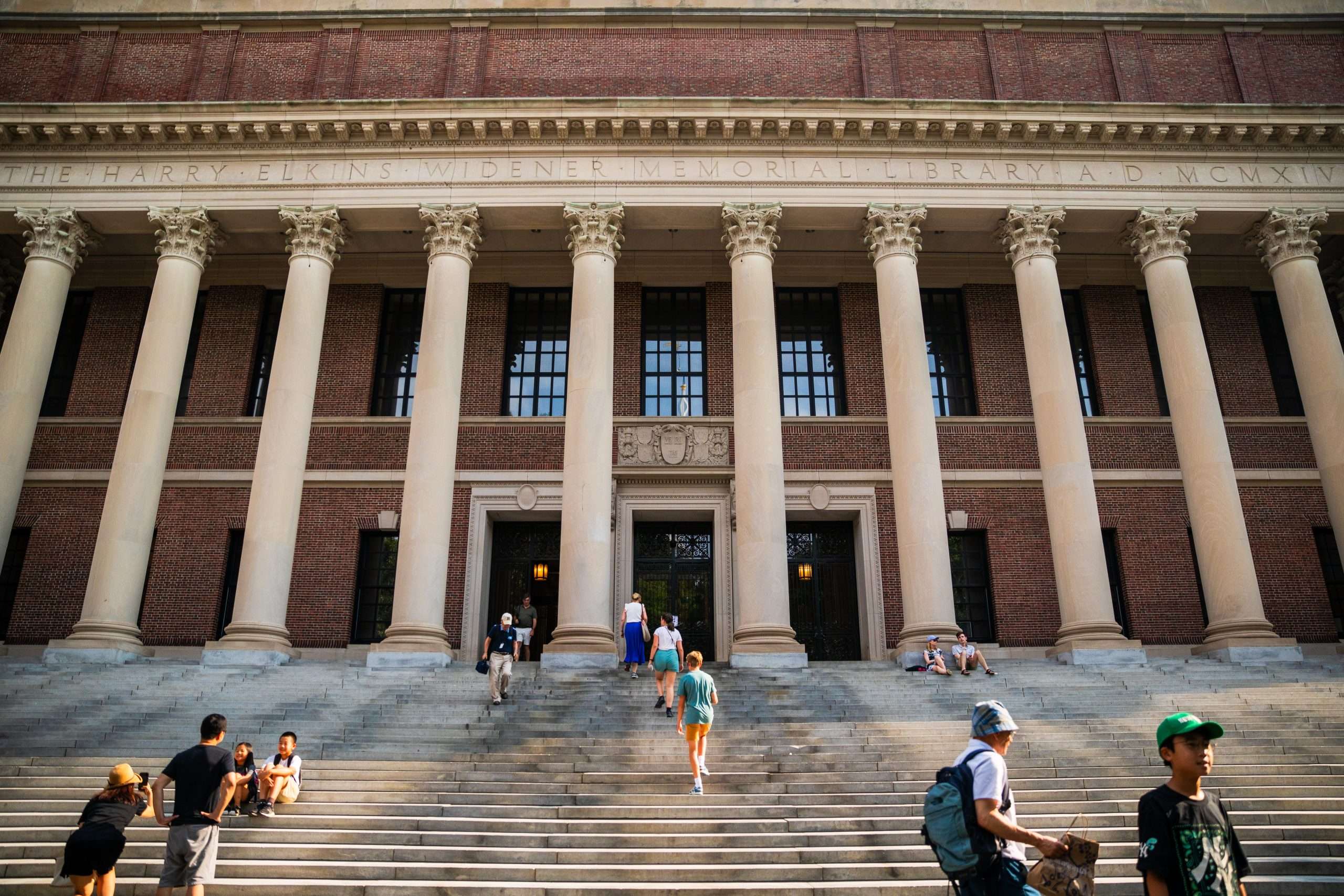 Students walk on the steps of Widener Library at Harvard.