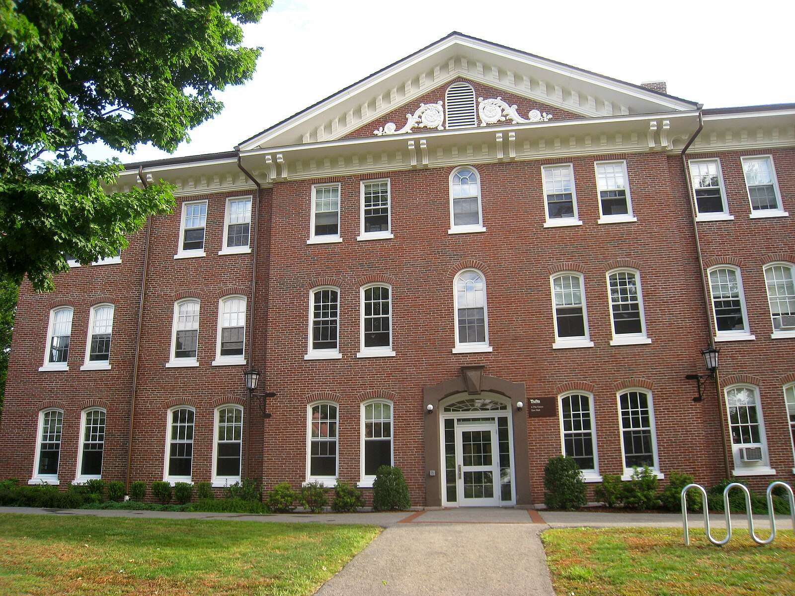 The brick facade of East Hall is featured at Tufts University.